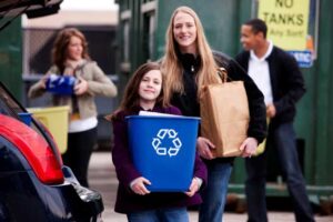 Mother and Daughter Unload Trash at the Recycling Center — Portland, OR — Portland Disposal & Recycling